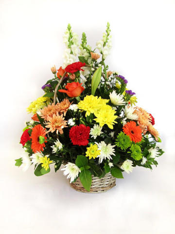 Mixed flowers in handle basket