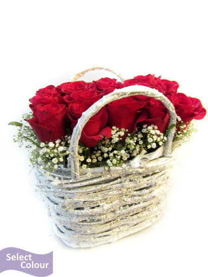Roses arranged in glitter handle basket