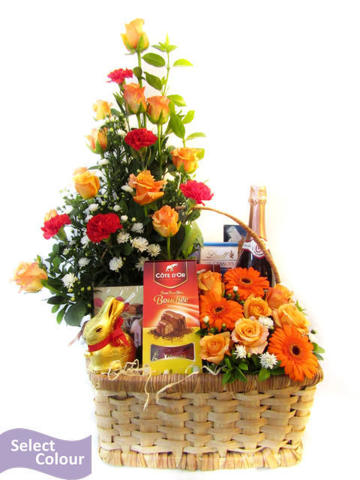 Roses, carnations, gerberas, with chocolates in handle basket