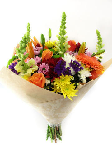 Mixed flowers arranged in craft paper