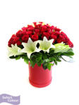 Roses and lilies displayed in box