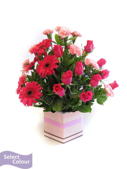 Roses, carnations and gerberas packed in box
