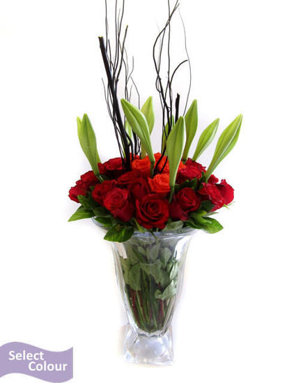 Roses and lilies in crystal vase