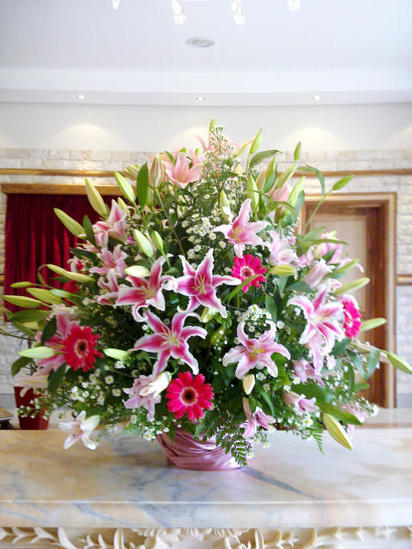 Stargazers, lilies and gerberas in ceramic pot