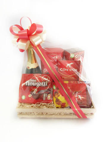 Sparkling juice and cote d'or chocolates in wooden crate