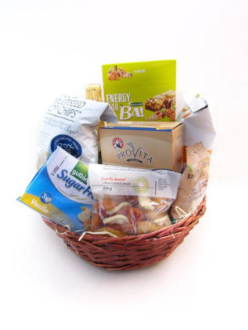 Dried fruit, nuts, granola bars in basket