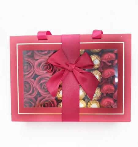 Roses, ferreros and chocolate hearts in gift box